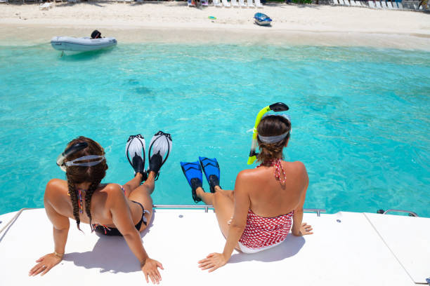 istock women on a boat getting ready to snorkel at a tropical beach 1288395972