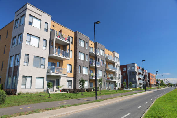 istock Modern Midsize Multi-Condos Building Block and Road in Summer 1288397201