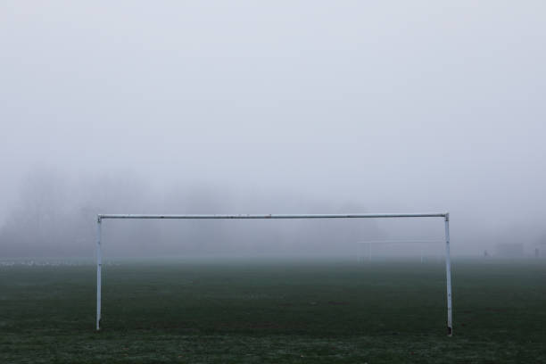istock Lone soccer goalposts in heavy autumn mist on Mitcham Common 1288398275