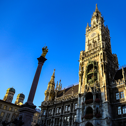 Low angle view of Marienplatz, The New Town Hall (Neues Rathaus) in Munich, Germany.