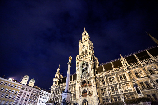 Low angle view of Marienplatz, The New Town Hall (Neues Rathaus) at night in Munich, Germany.