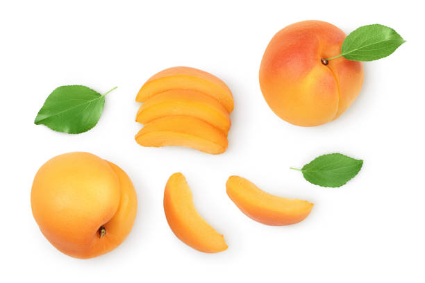 istock apricot fruit with half and slices isolated on white background. Clipping path. Top view. Flat lay 1288399301