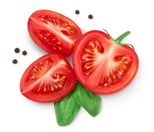 istock Tomato half and slices isolated on white background with clipping path and full depth of field. Top view. Flat lay 1288399353