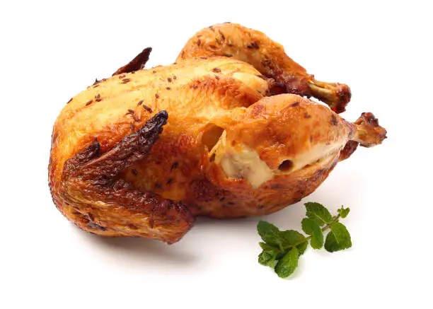 Whole roasted chicken against white background