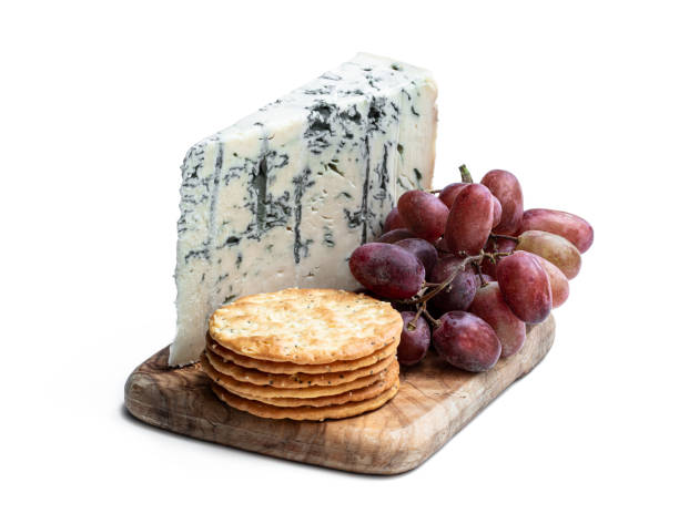 istock Gorgonzola cheese with grape and crackers isolated on white 1288401088