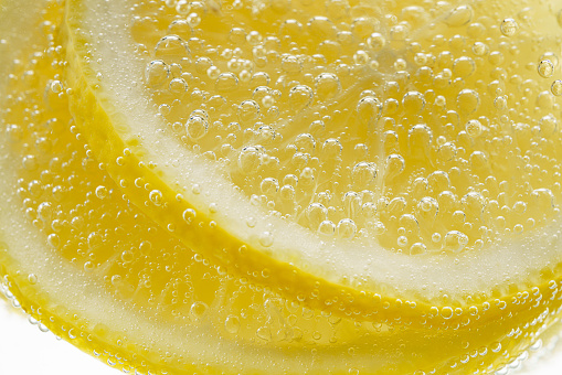 Sliced lemon in carbonated water
