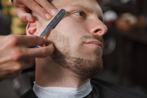 istock Handsome bearded man at barbershop 1288406608