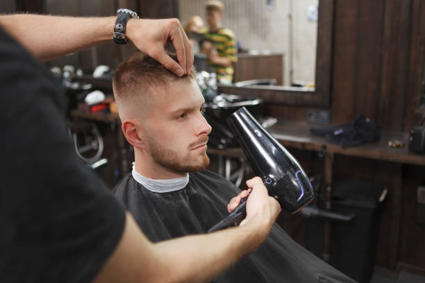istock Handsome bearded man at barbershop 1288407153