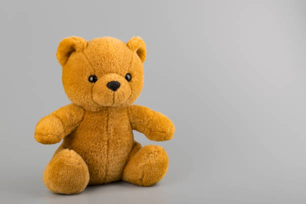 Teddy bear on grey background copyspace Teddy bear on grey background copyspace winnie the pooh photos stock pictures, royalty-free photos & images