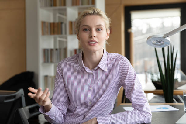 istock Web camera view young skilled businesswoman holding video call talk. 1288409507