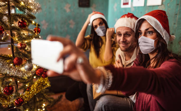 istock friend taking a selfie together for christmas 1288409637