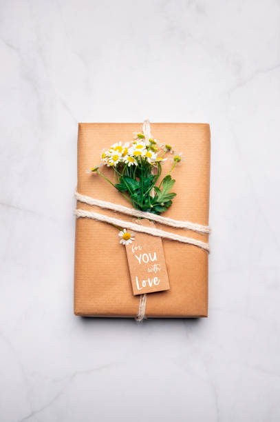 istock Eco friendly gift wrapped in brown paper 1288410034