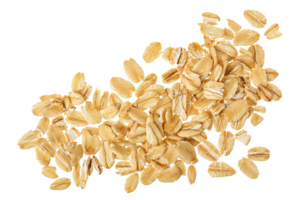 istock oat flakes isolated on white background. Top view 1288412812