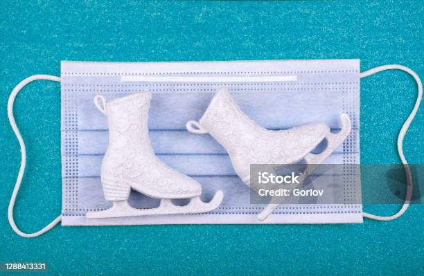 Image Of Skates Mask Blue Background Stock Photo - Download Image Now - Activity, COVID-19, Cheerful