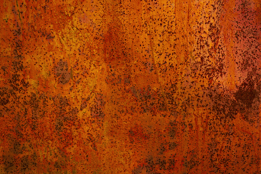 Rusty metal background. Rust texture. Orange red brown abstract background. Bright rough textured background.
