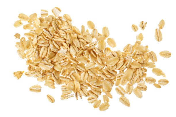 istock oat flakes isolated on white background. Top view 1288414315