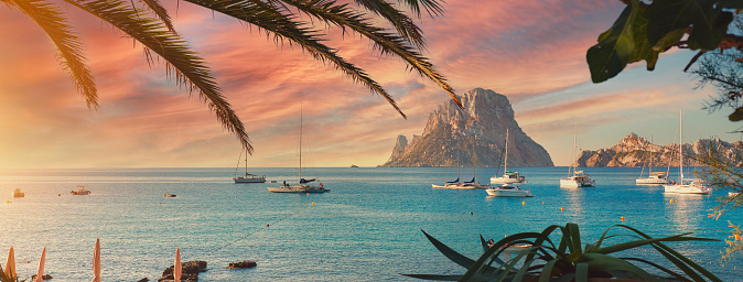 Cala d'Hort beach. Cala d'Hort in summer is extremely popular, beach have a fantastic view of the mysterious island of Es Vedra. Ibiza Island, Balearic Islands. Europe, Espana, Spain