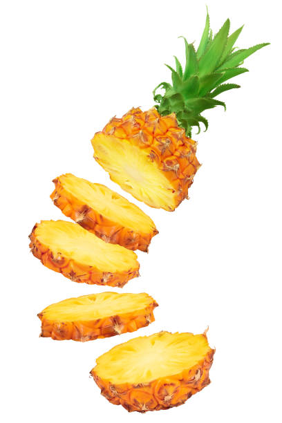 istock falling pineapple slices isolated on white background with full depth of field 1288416818