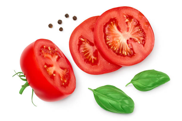 istock Tomato slices with basil and peppercorns isolated on white background. Clipping path and full depth of field. Top view. Flat lay 1288416860