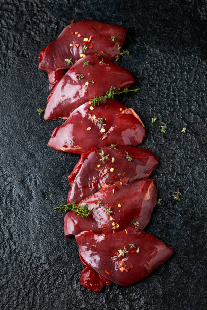 pigeon breast fillets ready to cook with seasoning mix on wooden board pigeon breast fillets ready to cook with seasoning mix on wooden board. squab pigeon meat photos stock pictures, royalty-free photos & images