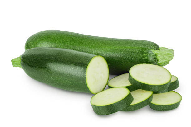 istock Fresh whole and sliced zucchini isolated on white background with clipping path and full depth of field 1288418963