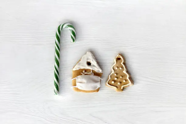 striped lollipop, medical mask gingerbread house and ginger tree