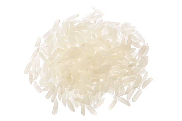 istock rice grains isolated on white background. Top view. Flat lay 1288420195