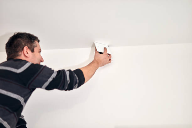 istock Electrician fixing wires and electrical instalation at home. 1288421416