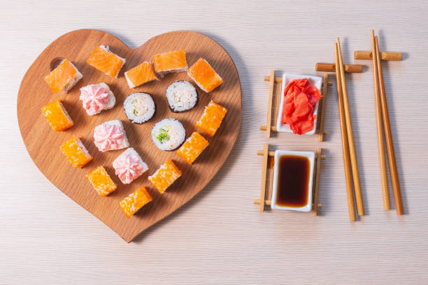 istock valentines day. Rolls stacked, soy sauce and sticks 1288425192