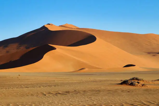 Photo of giant red sand dunes in Sossusvlei Namib Desert - Namib-Naukluft National Park, Namibia, Africa