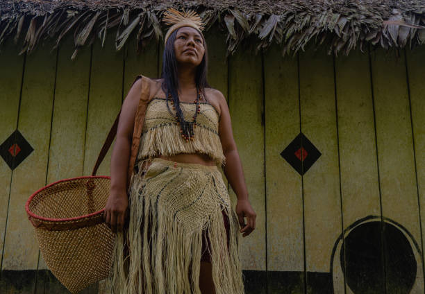 istock Colombian indigenous woman with a basket 1288426080