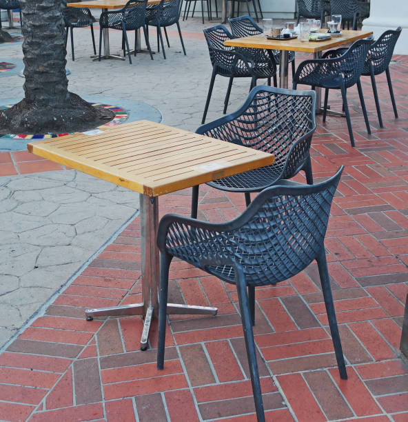 istock Tables and Chairs on Sidewalk for Dining 1288428999