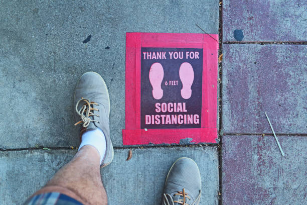 istock Social Distancing Red and Black And A Person's Feet 1288429004