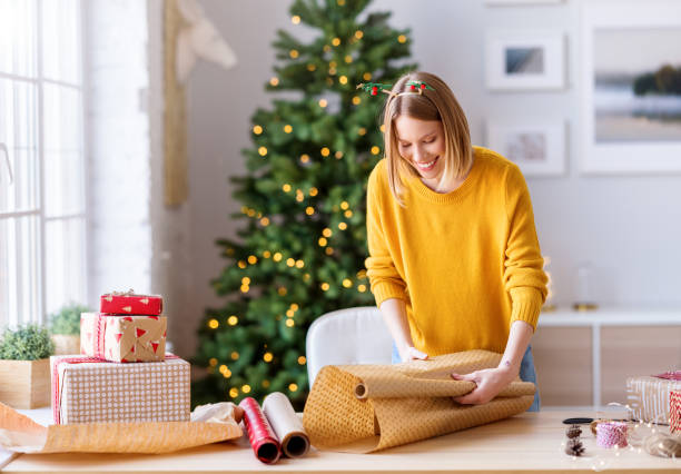 istock Friendly female packing Christmas gifts 1288430062