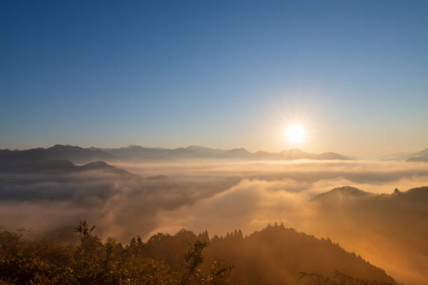 Beautiful sight of clouds spreading like the sea in Takachiho Gorge in the early morning and the rising sun Beautiful sight of clouds spreading like the sea in Takachiho Gorge in the early morning and the rising sun miyazaki prefecture stock pictures, royalty-free photos & images