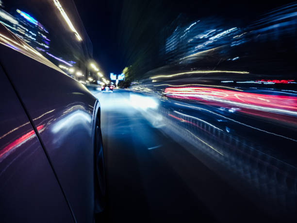 istock POV Car Driving on the Road at Night 1288431383