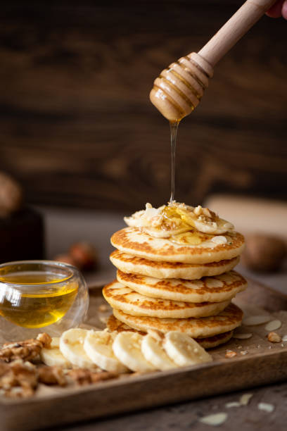 istock small pancakes with banana, walnuts and honey 1288431591