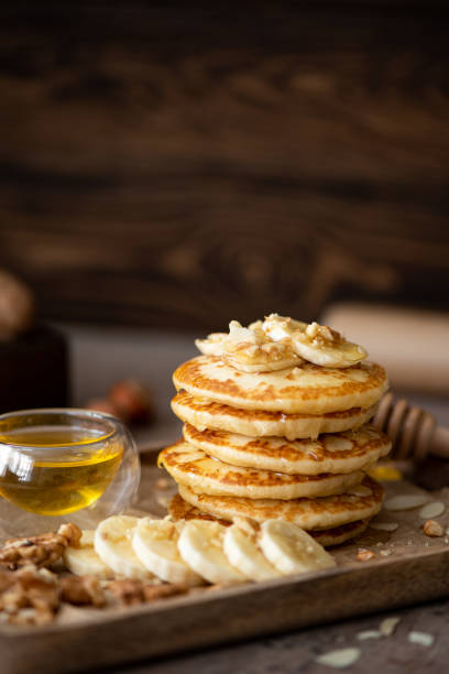 istock small pancakes with banana, walnuts and honey 1288431600