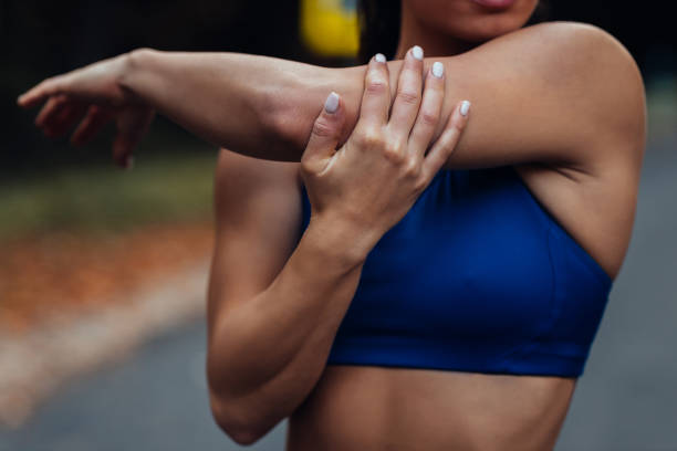 istock Young female runner warming up before running at forest trail 1288432790