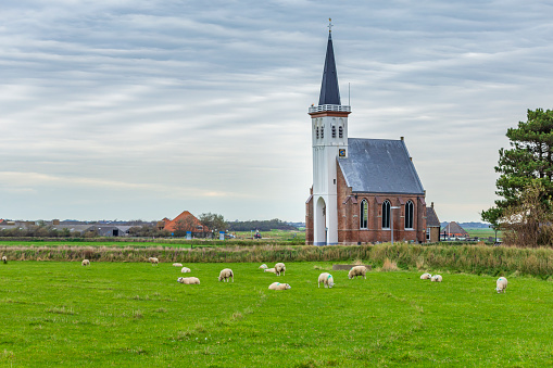 Rural view of meadows and the village of Hazerswoude-dorp in the west of the Netherlands.