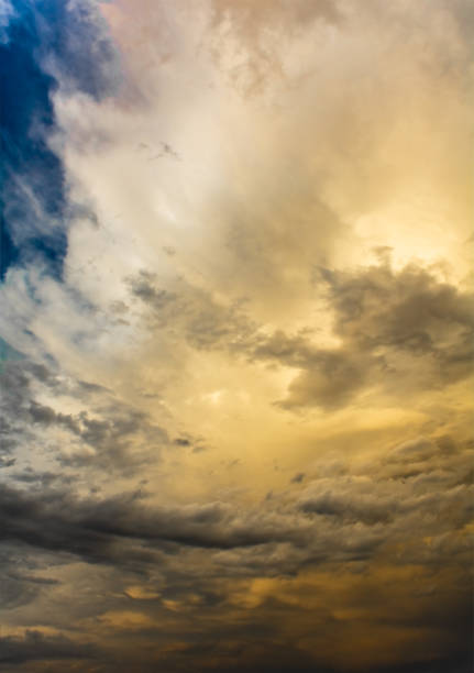 istock Blurred blue yellow dramatic stormy sky and cloud before the storm 1288435389