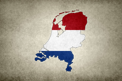 Grunge map of the Netherlands with its flag printed within its border on an old paper.