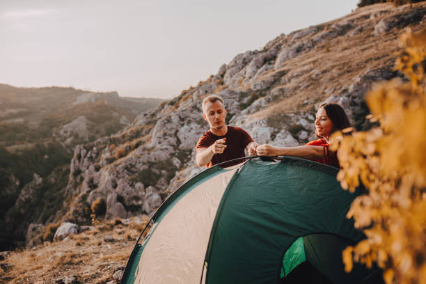 istock A young couple sets up a tent 1288441684