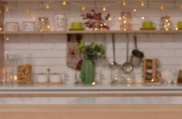 istock Empty wooden table on background of christmas kitchen.Copy space for text 1288442187