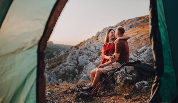 istock Happy Man and woman on a romantic camping vacation 1288443109