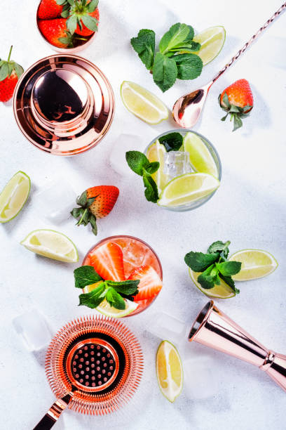 istock Mojito mocktail set with lime, mint, strawberry and ice on white background. Cold alcoholic non-alcoholic long drinks, beverages and cocktails 1288443788