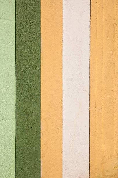 istock Multicolored striped house facade, close-up. 1288446257