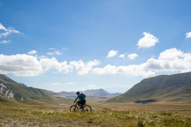 istock Mountain biker riding his bicycle on a mountain trail 1288447549