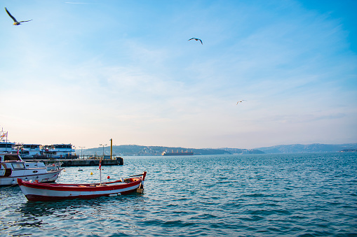 white and red fishing boat in Istanbul strait. white and red fishing boat in Turkey. Fishing boat in bosphorus.