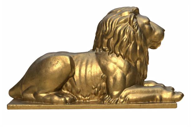 istock 3D render of lying lion gold sculpture isolated on white 1288450501
